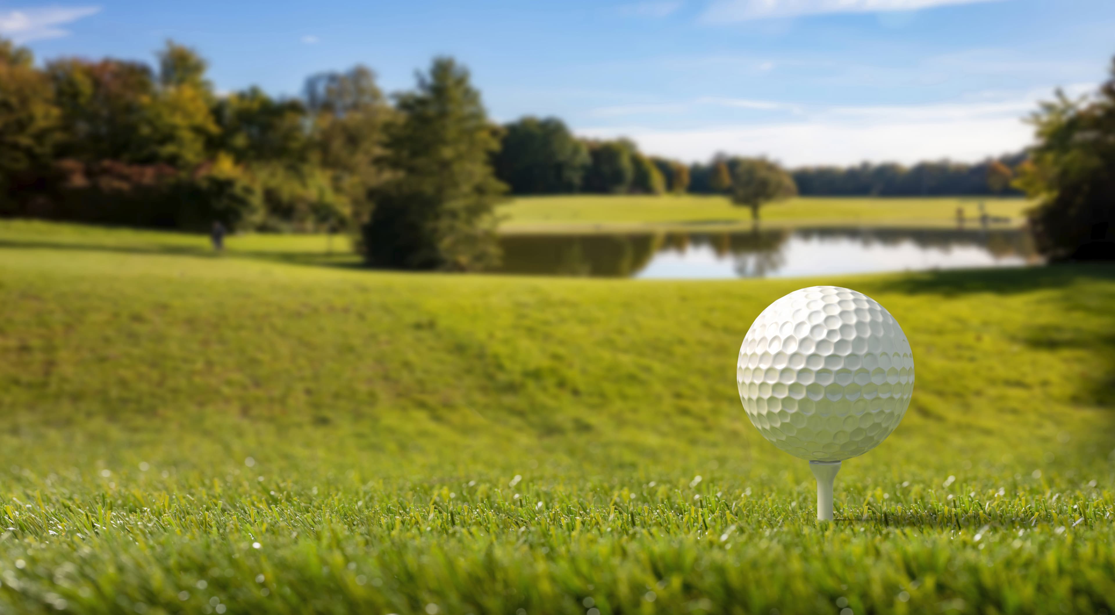 Golfer swinging on a beautiful golf course